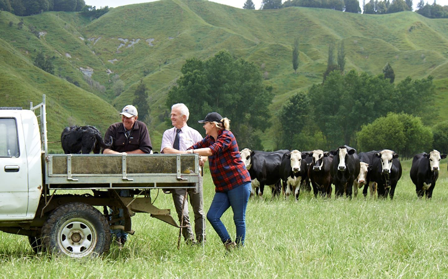 Farmers with branded caps and promotional merchandise